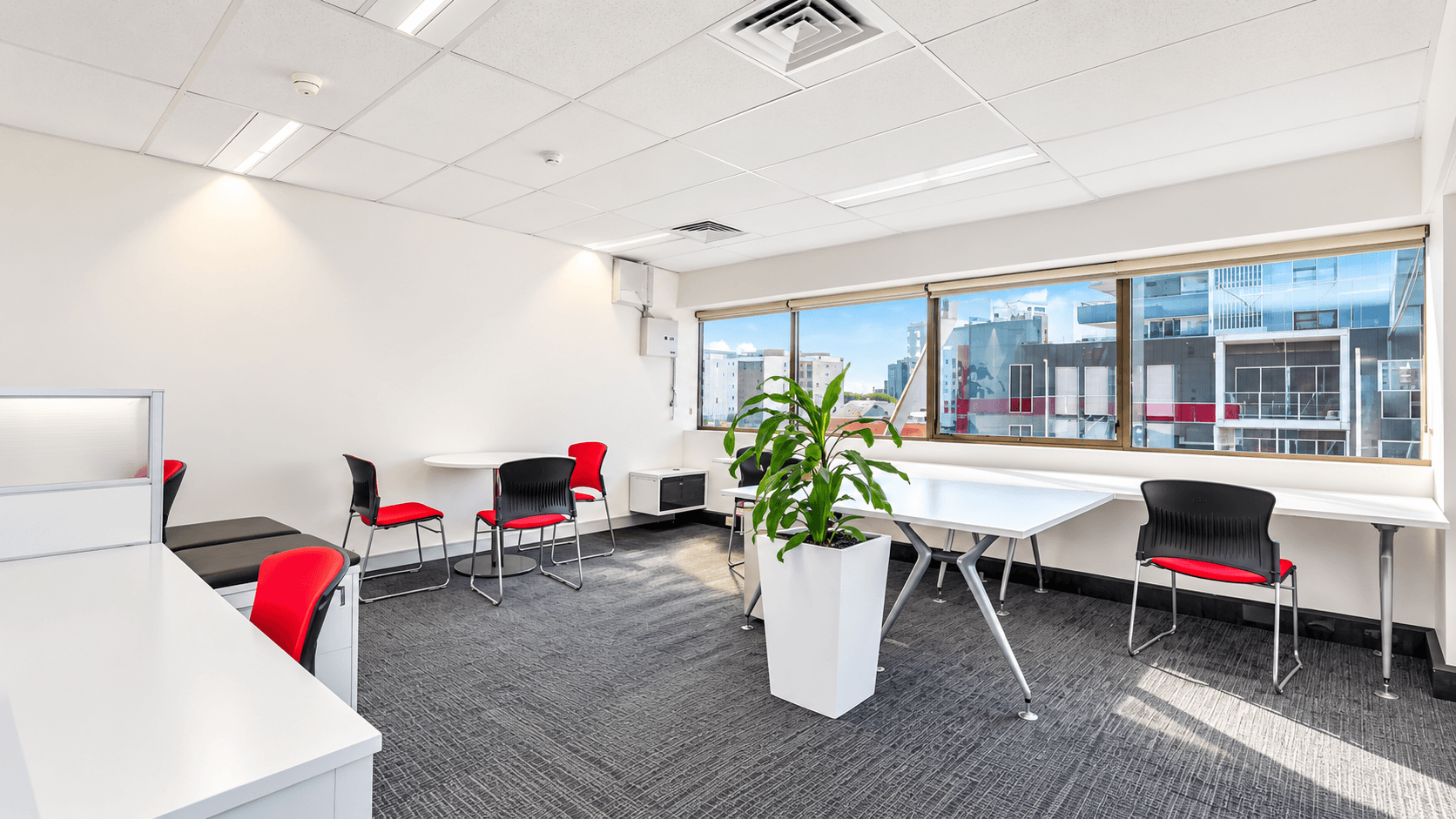 Level 8 office breakout area with window views