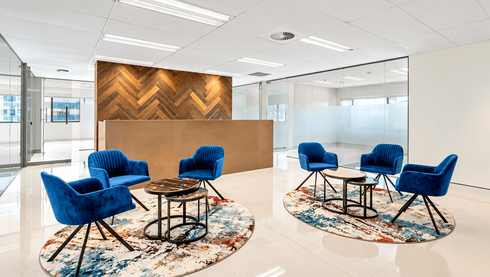 Level 8 reception area with seating and timber feature wall